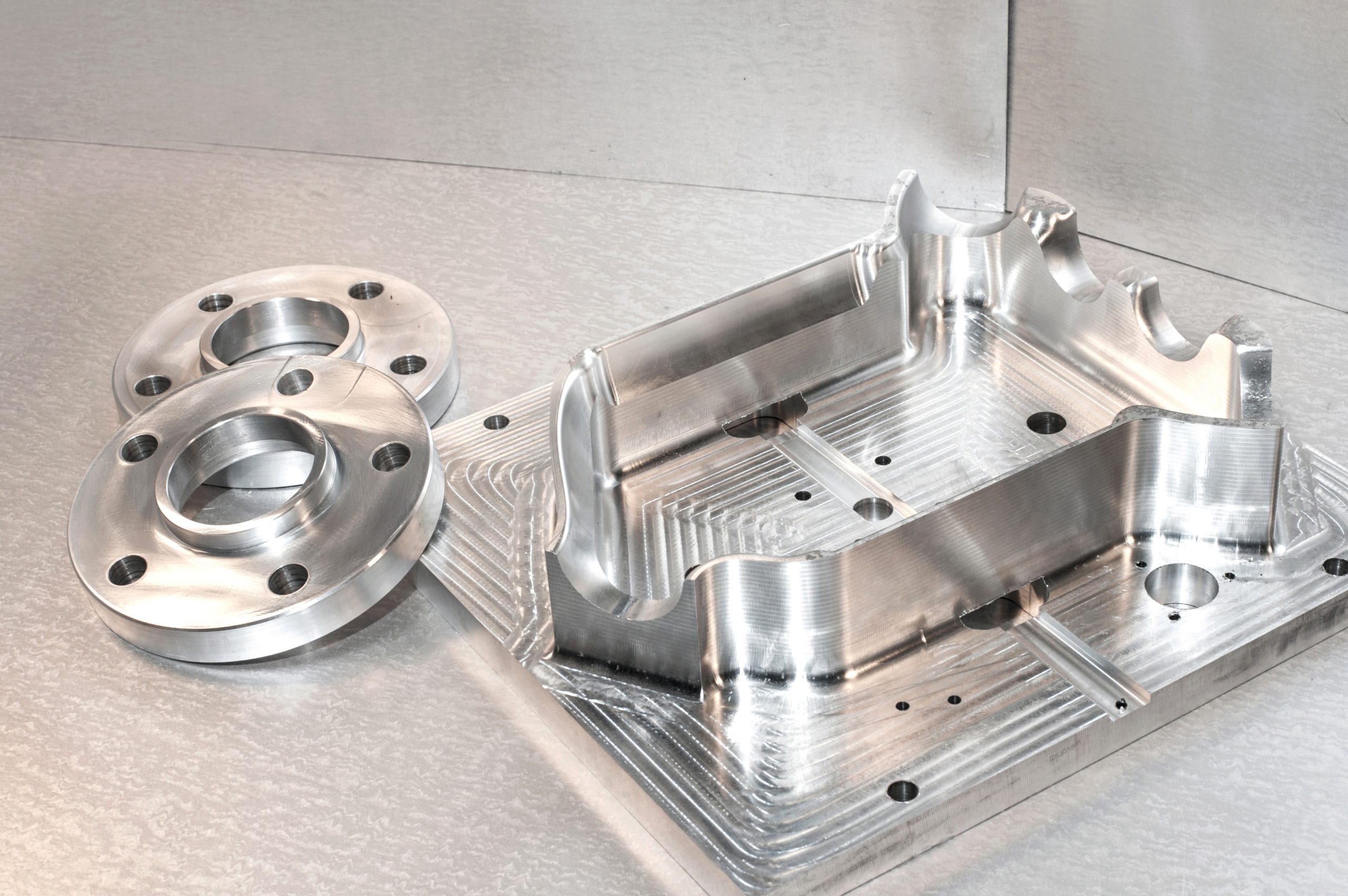 Metal mold and steel flanges. Milling industry. CNC technology. Metal mold/blank and steel flanges. Milling and drilling industry. CNC technology. Mechanical engineering